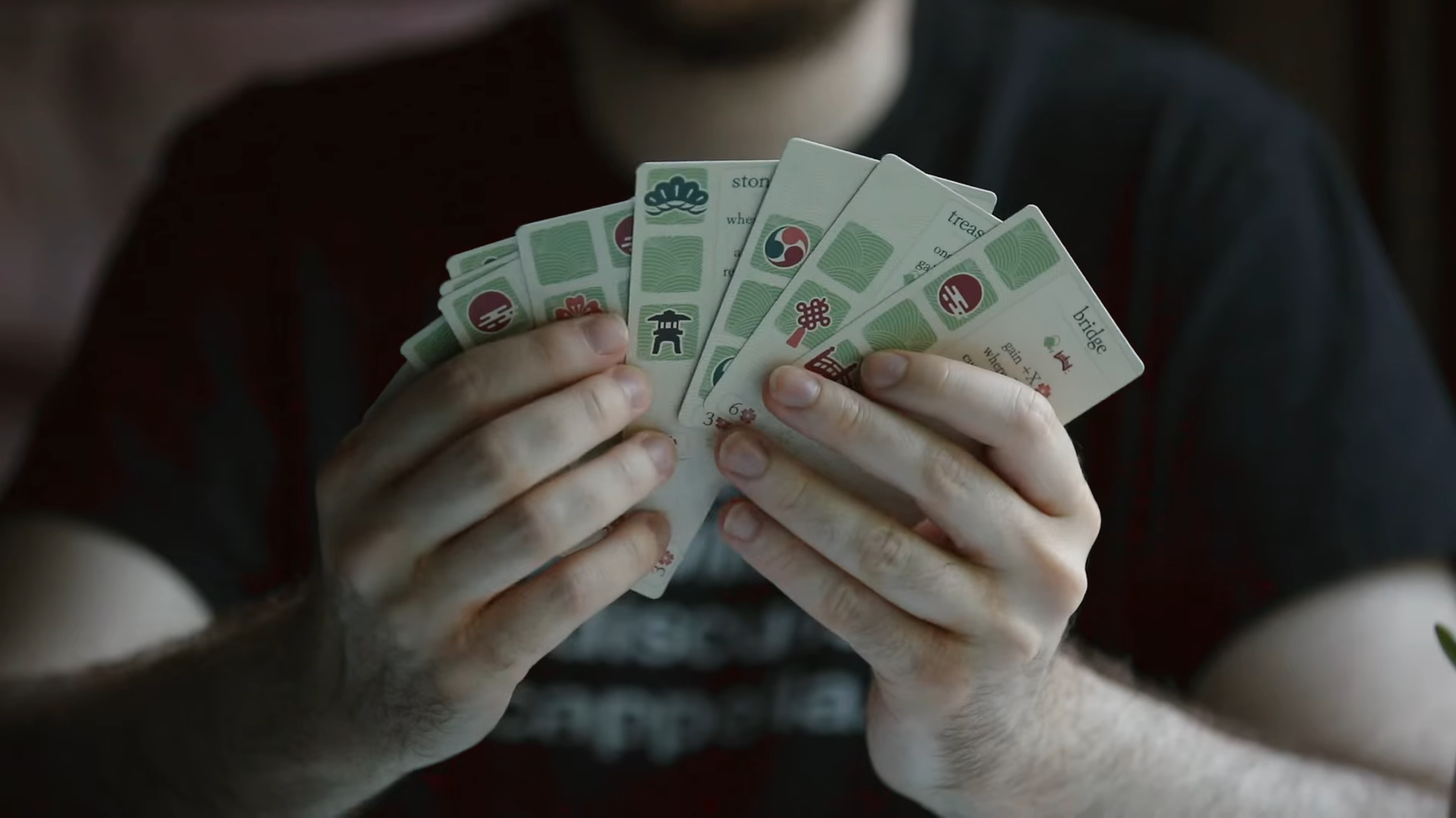 hands holding advanced cards